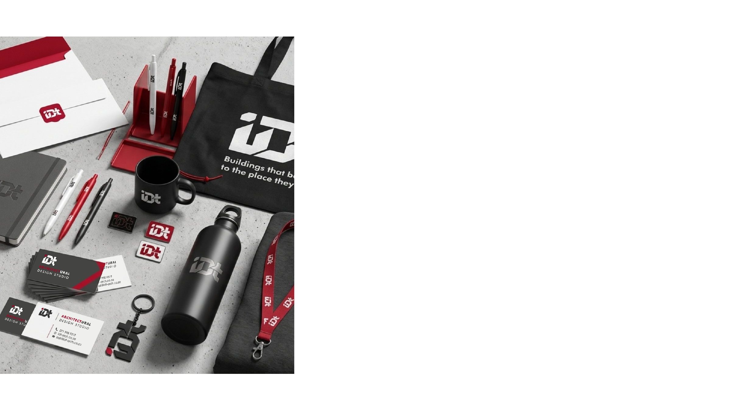 IDT Architectural Design Studio branded stationery, drinkware and tote bags laid out on a light surface.