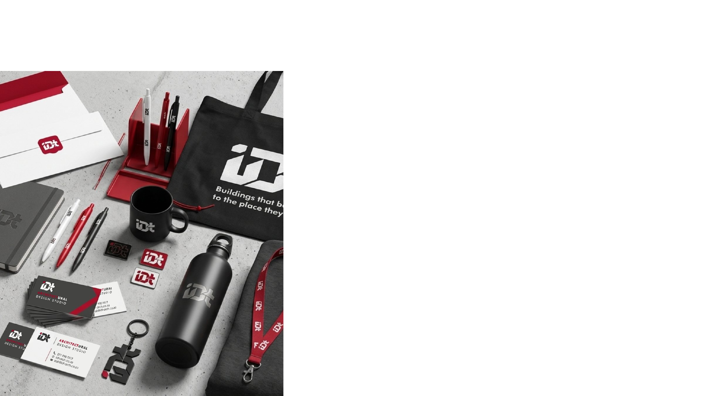 IDT Architectural Design Studio branded stationery, drinkware and tote bags laid out on a light surface.